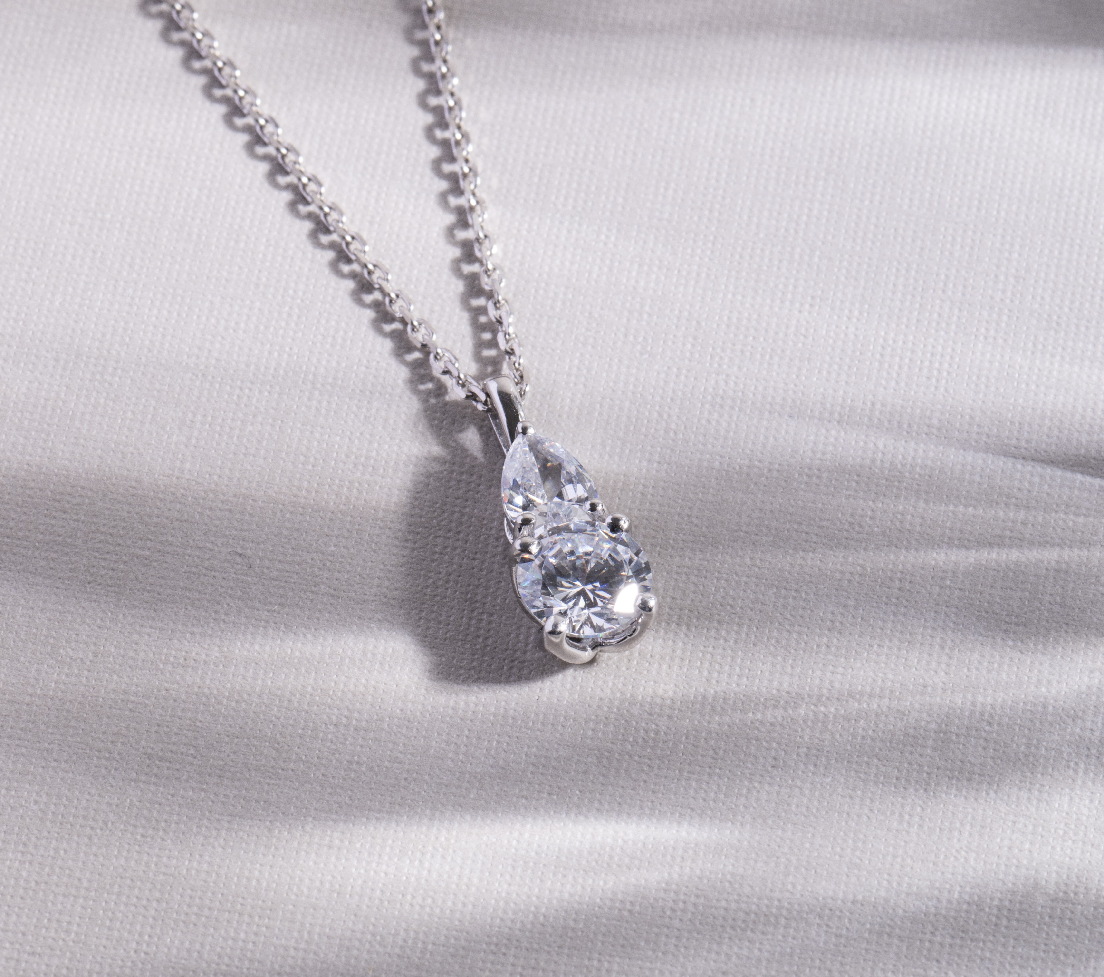 Dual Beauty of Pear & Round Gold Pendant